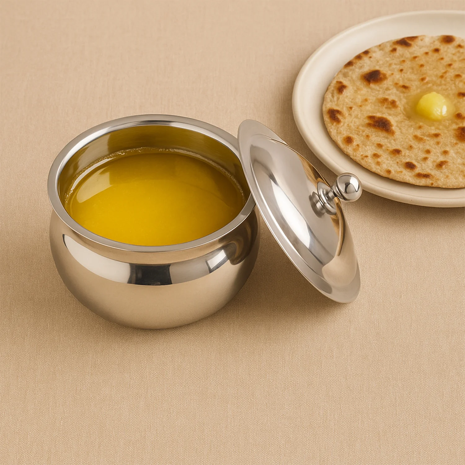 08-8274_koko_ss_ghee_pot_with_lid_n_spoon.webp Stainless Steel Ghee Pot with Lid & Spoon – Mirror Finish - Ghee Pot product image 8